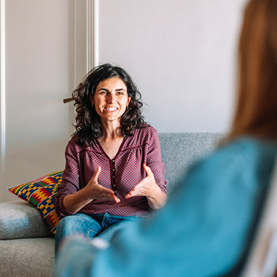 A woman speaks to a counselor